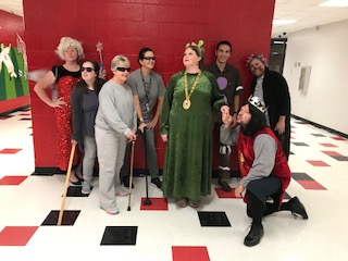 (from Left to Right) Mrs. Monroe as the Fairy Godmother, Ms. Duke as a Blind Mice, Mrs. Winton as a Blind Mice, Mrs. Nicoll as a Blind Mice, Mrs. Phillips as Fiona, Mr. Wanuch as the Gingerbread Man, Mr. Stein as Lord Farquaad, and Mr. Jamison as the Wolf.