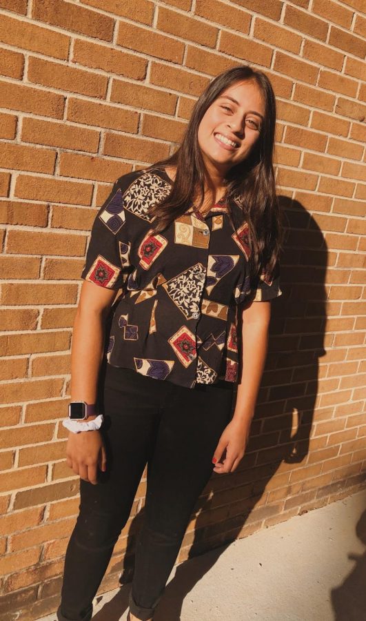 Kushi Zaver wears her upcycled shirt
 that was originally an old dress. 
