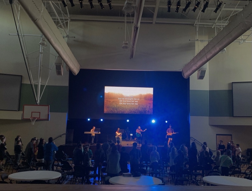 Students involved in First Baptists praise team perform for their Wednesday night service.