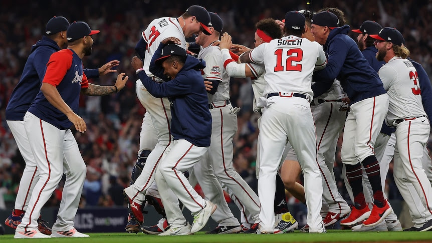 The Braves celebrate after beating the Dodgers to advance to the World Series.