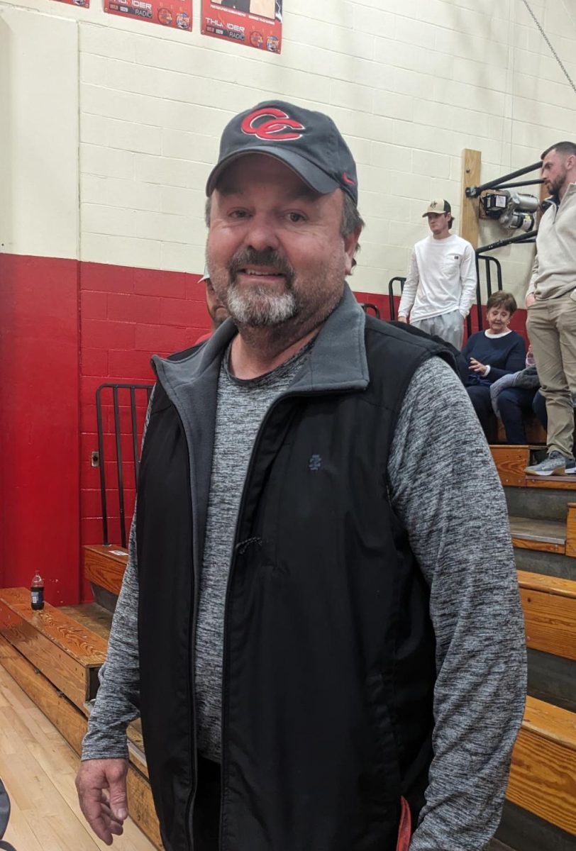 Coach Haynes, pictured above, supports the Red Raider basketball team during their game against Franklin.
