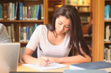 As pictured above, a young woman is deep in a study session.