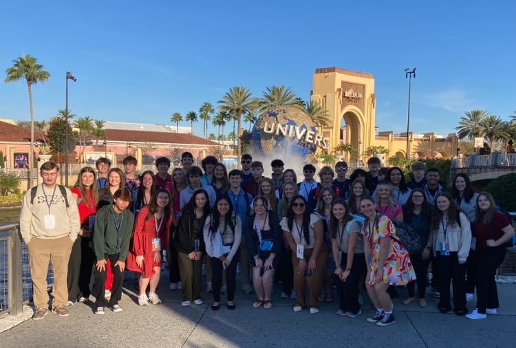 The CCCHS DECA chapter gathers for a group photo at Universal Studios Florida.