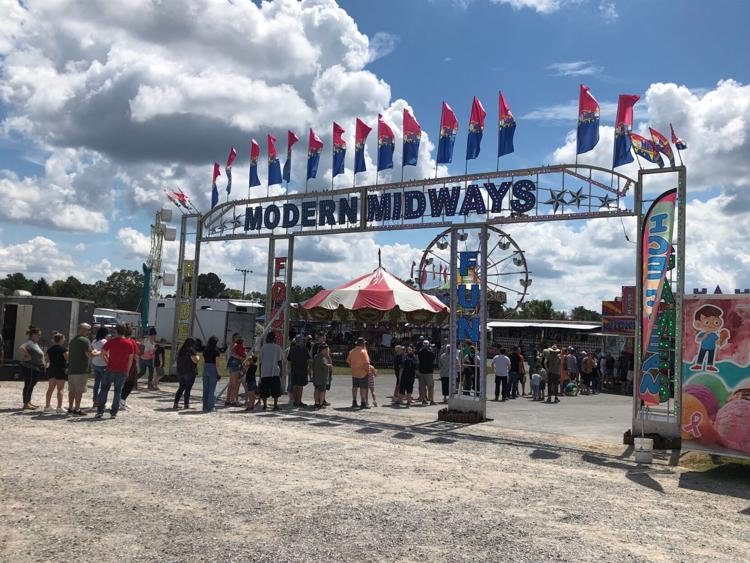 People waiting to get into the Coffee County Fair. 